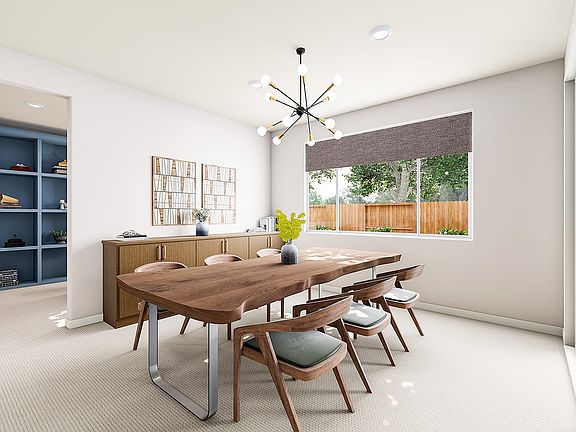 A modern and minimalist dining room with a large wooden table, chairs, and a chandelier hanging over