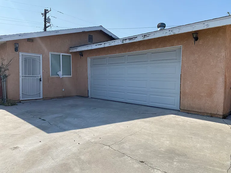 Exterior with driveway and 2 car garage