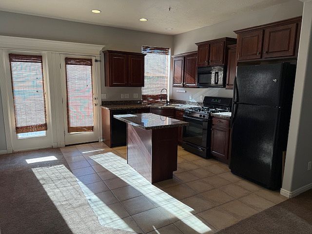 Beautiful kitchen with upgraded appliances and gas stove.