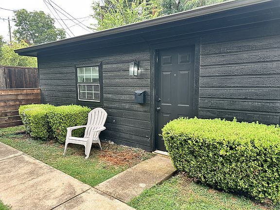 Unit entrance is inside a locked fence.