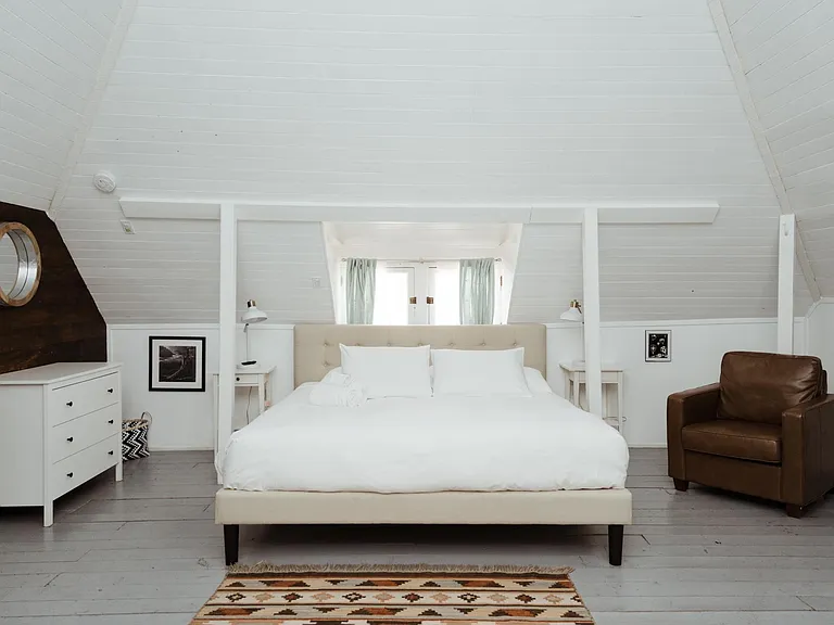 huge upstairs bedroom with soaring 26ft ceiling