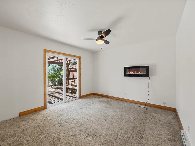 Primary bedroom with access to the backyard deck
