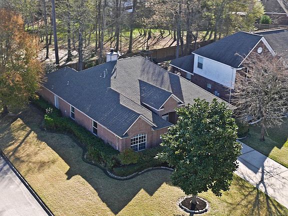 Aerial view this lovely ALL BRICK 1 story home with 4/2/2 showing its recent NEW roof & quiet Park b