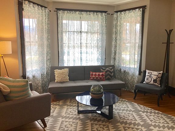 Front room and entry with bay window.