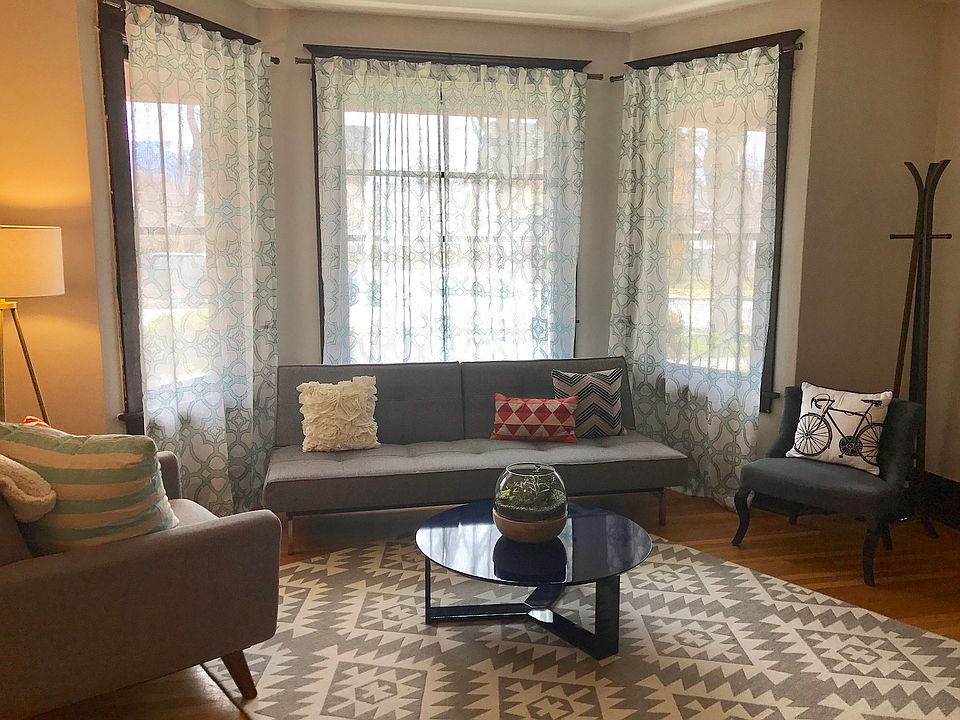 Front room and entry with bay window.