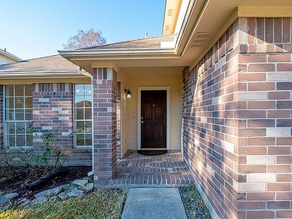 Standout with the contrasting brick pattern and newly refinished front door!