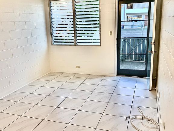 Another view of living room to the front door