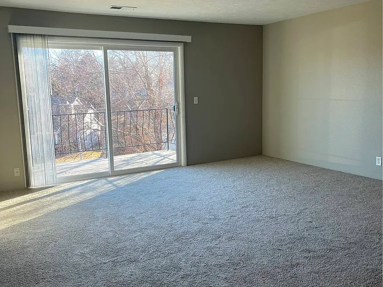 Large sliding glass doors in a unit at Whispering Isle.