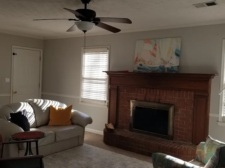 Living room opens to a two-level deck