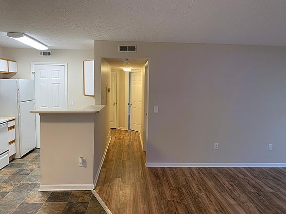 Main entry, kitchen/dining, and living room.
