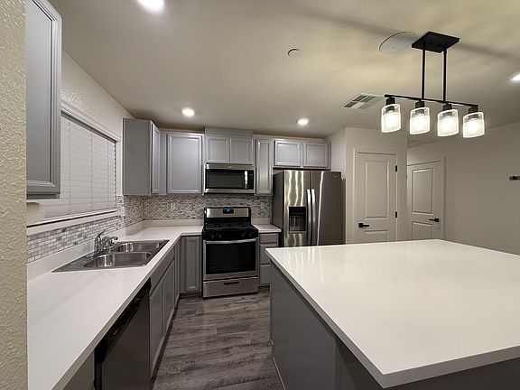 Stainless steel appliances and upgraded lighting fixtures.