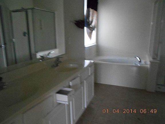 Master bathroom has tub with seperate shower and large walk in closet
