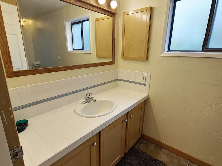 Bath vanity with glamour lighting