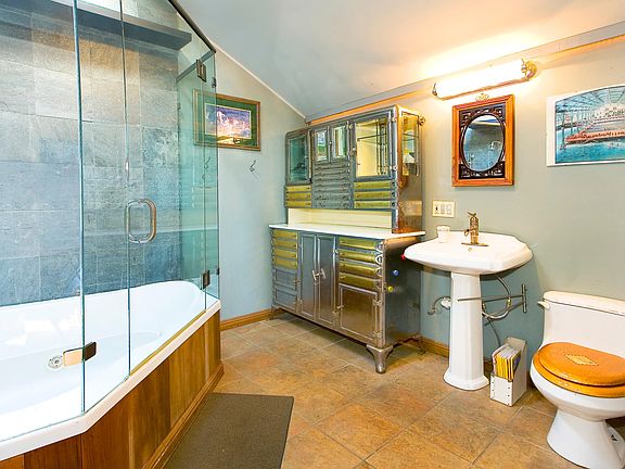 Jacuzzi tub and glass shower enclosure. Very cool vintage de