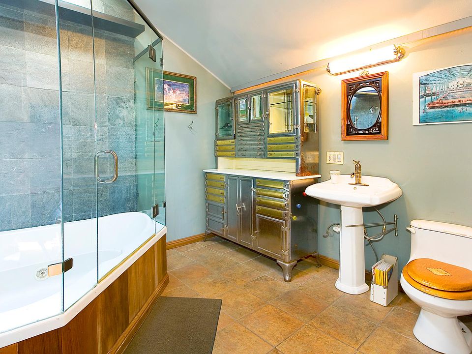 Jacuzzi tub and glass shower enclosure. Very cool vintage de