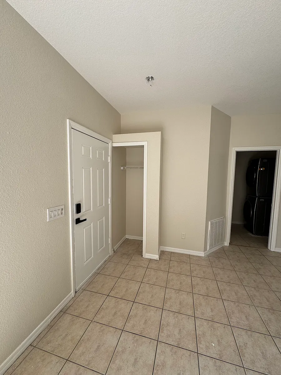 Entry way into large living room. Hall closet - 7511 Coral Tree