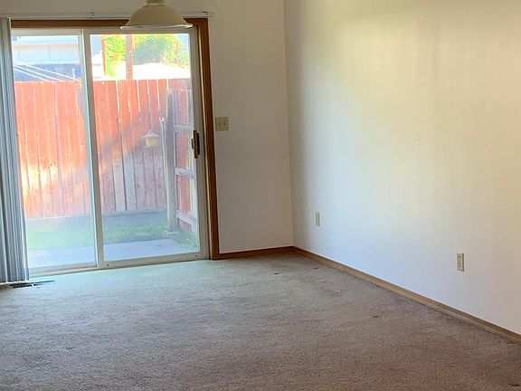 living room/dining area with sliding door to patio.