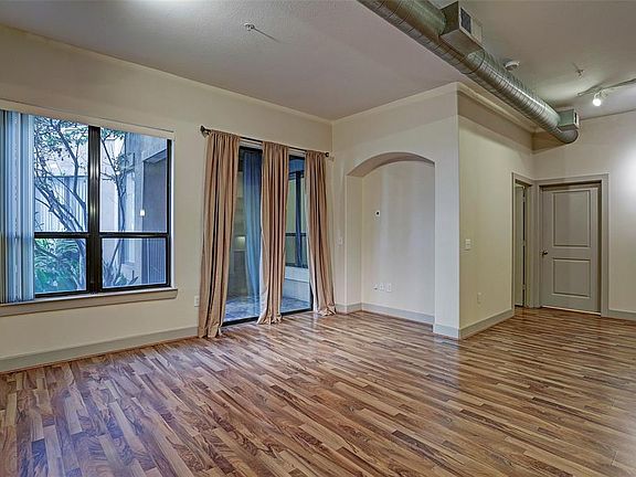 View of the living room with sliding doors to patio