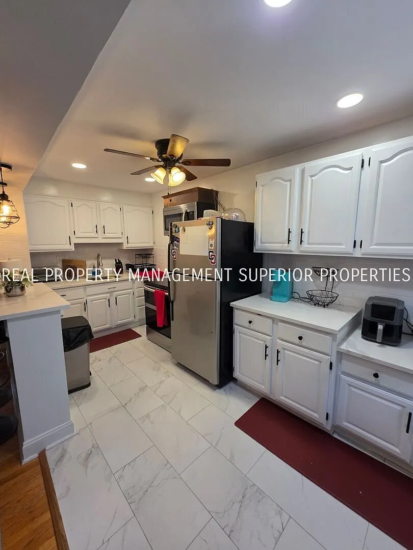 Spacious 3-Bedroom, 2-Bath Home with Finished Basement, Parking & Central Air — Photo 2