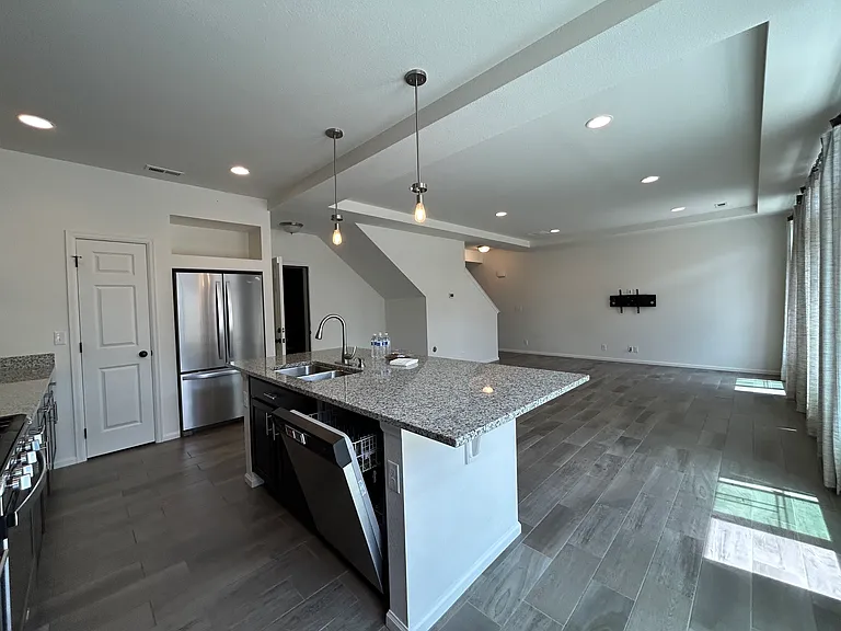 Open space of living, dining, and kitchen from kitchen