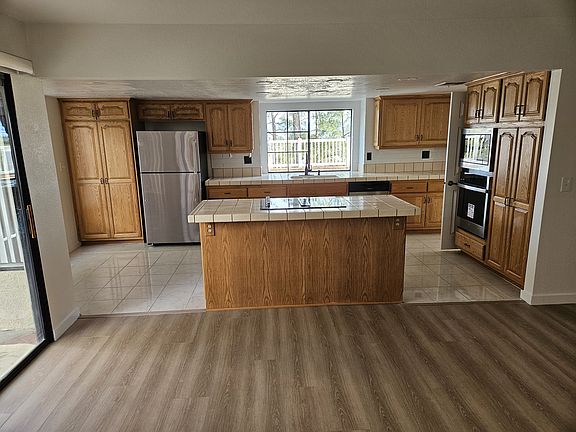 REMODELED KITCHEN WITH A LOVELY ISLAND