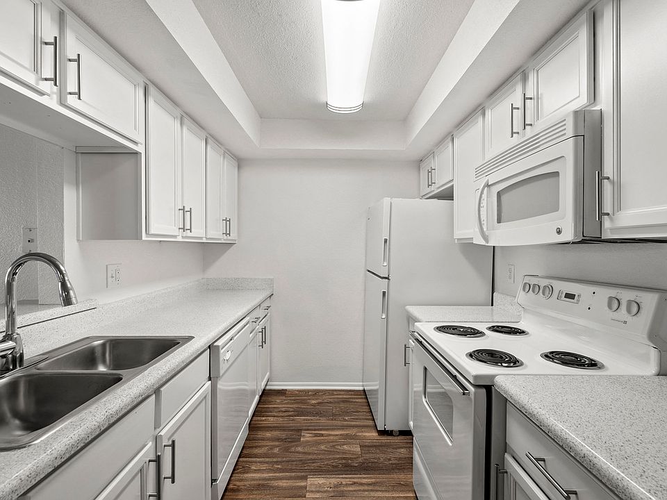 apartment kitchen with white appliances