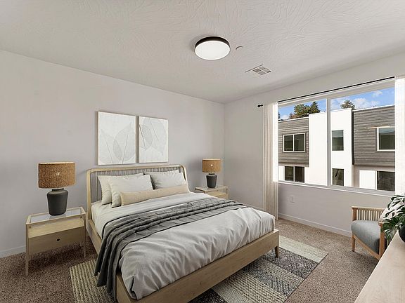 Bright, modern bedroom with elegant neutral tones, large window, and stylish decor for a serene retreat.