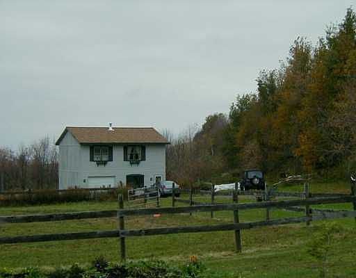 Front with 3 fenced in pastures
