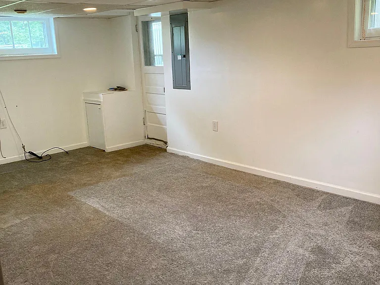 This is a basement room that could be used either as an office or as a fourth bedroom.