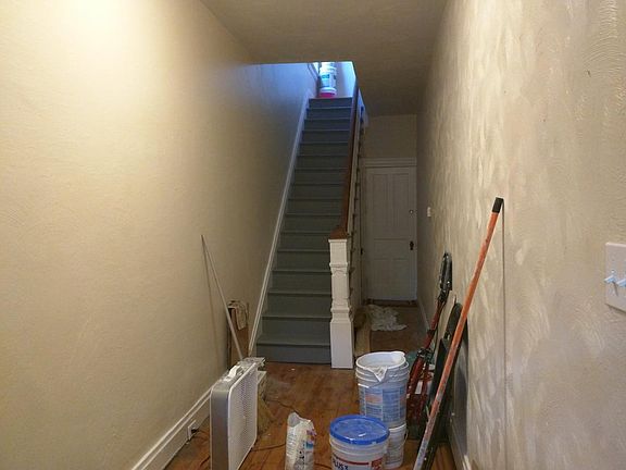 Huge 1st floor entry hallway with basement entry below stair