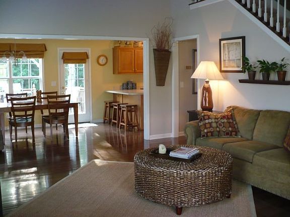 Two-story living room with hardwood floors and open floorplan