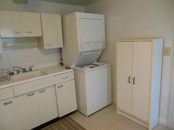 Kitchen: washer/dryer, cupboard