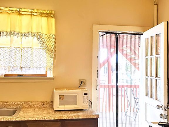 Kitchen - Photo 3 (door connects to ground patio and spacious backyard)