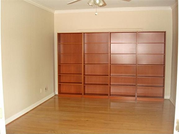 Large study has wood floors and removable bookshelves.  bookshelves can be removed.