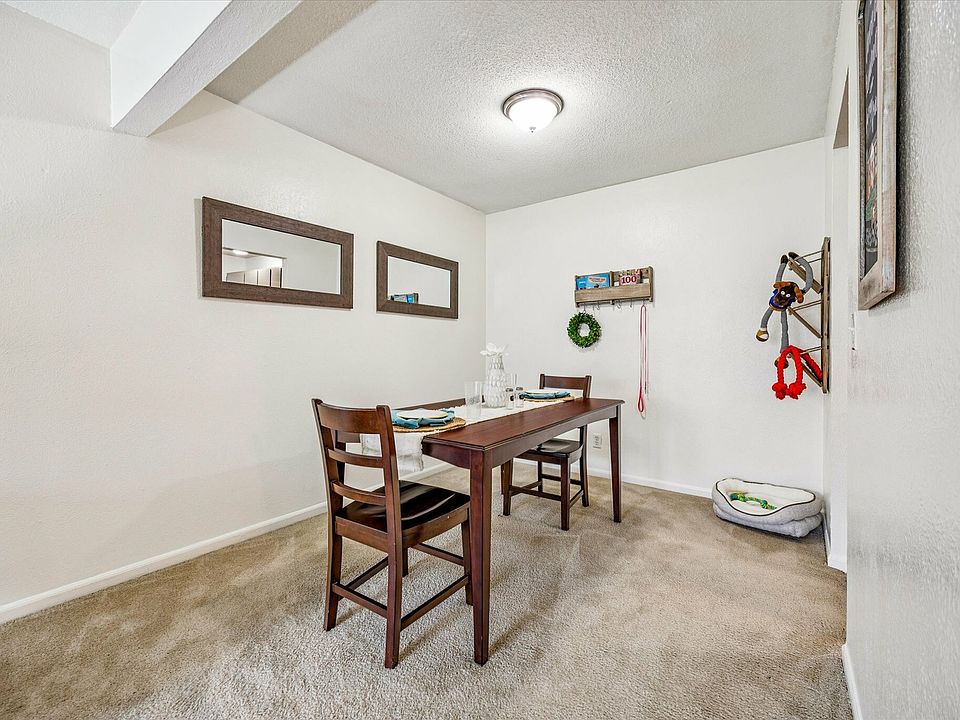 Enjoy a cozy dining space with modern furnishings at University Hills Apartments near the University of Toledo.