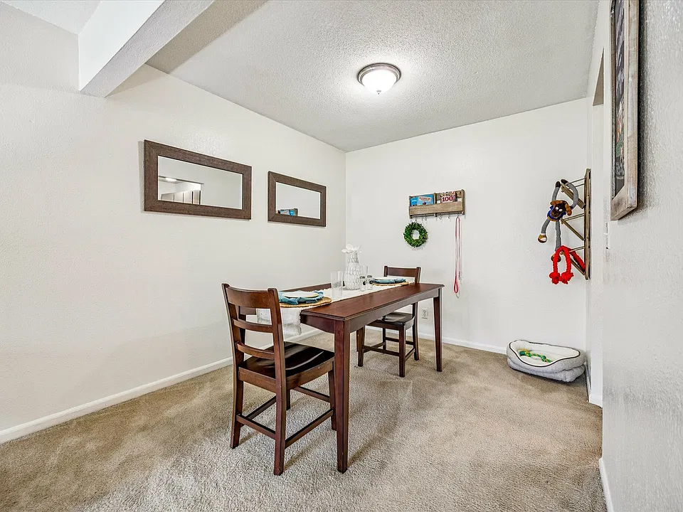 Enjoy a cozy dining space with modern furnishings at University Hills Apartments near the University of Toledo.