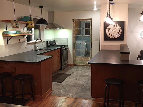 Kitchen view from Dining Area. Sliding door leads to laundry room.