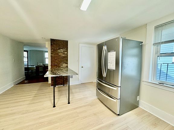 Brand New Kitchen Floor, Breakfast Bar, Countertops + Stainless Steel Refrigerator - Installed - July 2024!