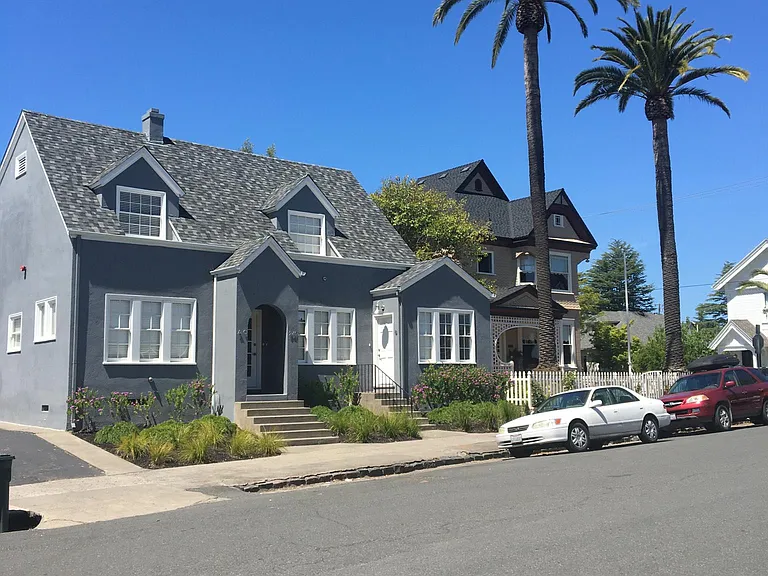 Street view. The subject property is a stand alone building in the rear of the property.