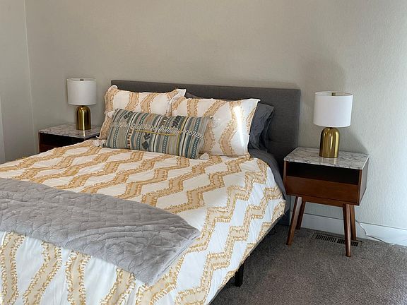 Master bedroom with high ceilings, en suite dual vanity bathroom with modern shower, walk in closet. Separate entrance to rooftop patio.