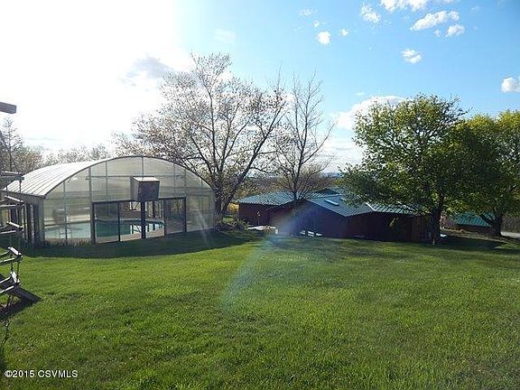 Overlooking the pool and rear of the home