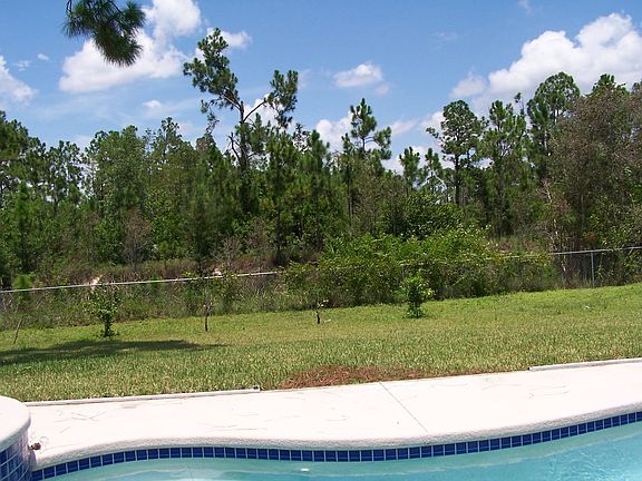 NICE SIZED COVERED PATIO, ACCESS FROM LIVING ROOM AND MASTER.