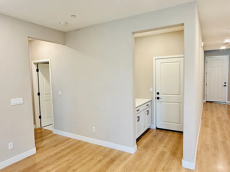Garage Exit with storage and Guest bedroom/bath towards left.