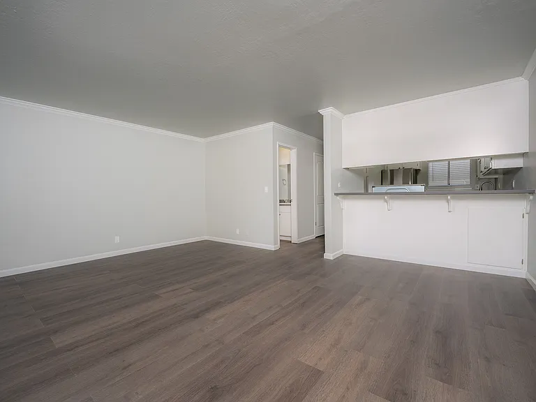 Experience the elegance of this spacious open-plan living area, perfect for modern living.