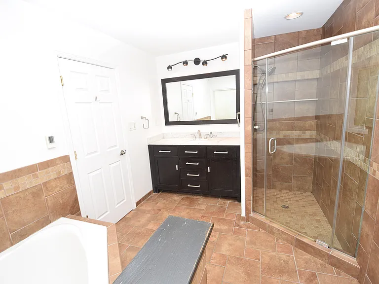 Owner's Tiled Bathroom.
