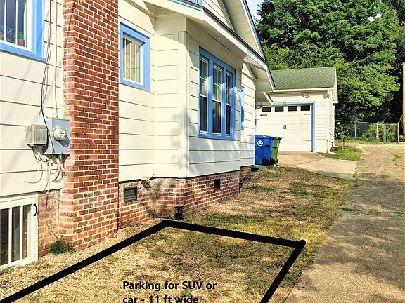 Parking for two cars on the side of the house - Toyota Tacoma is largest size that can fit easily