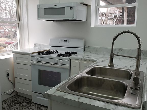 New updated kitchen stove with oven, brand new counters and plenty of storage spaces.