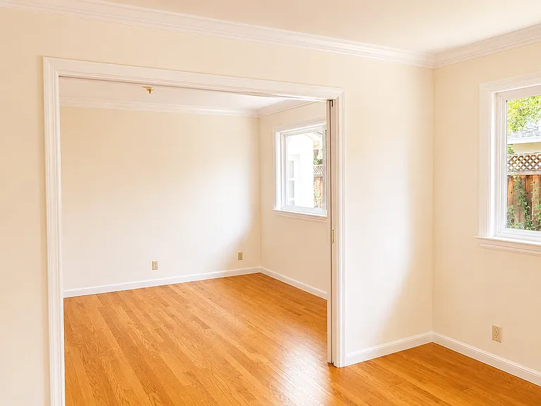 Twin bedrooms divided by a sliding door.