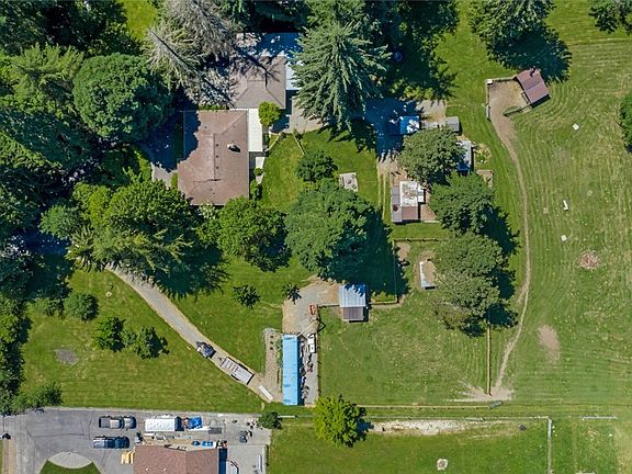 What a fantastic view of the urban farmstead that could be yours! Peace, tranquility & practicality rule here. Wrangle your cows, get your garden on and then relax in your charming rambler with all the comforts you could want