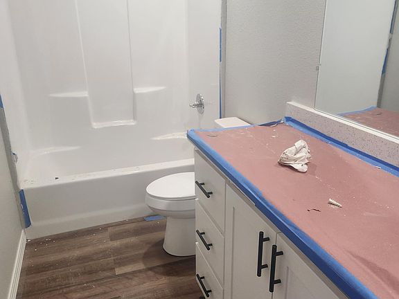 The cabinet counter is white granite. Duplexes are still in progress.